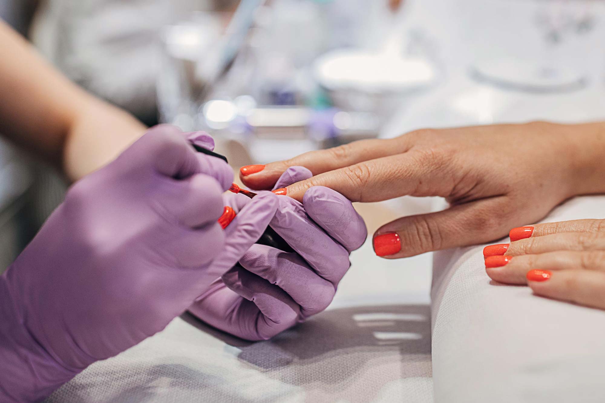 Close-up of woman getting her nails painted