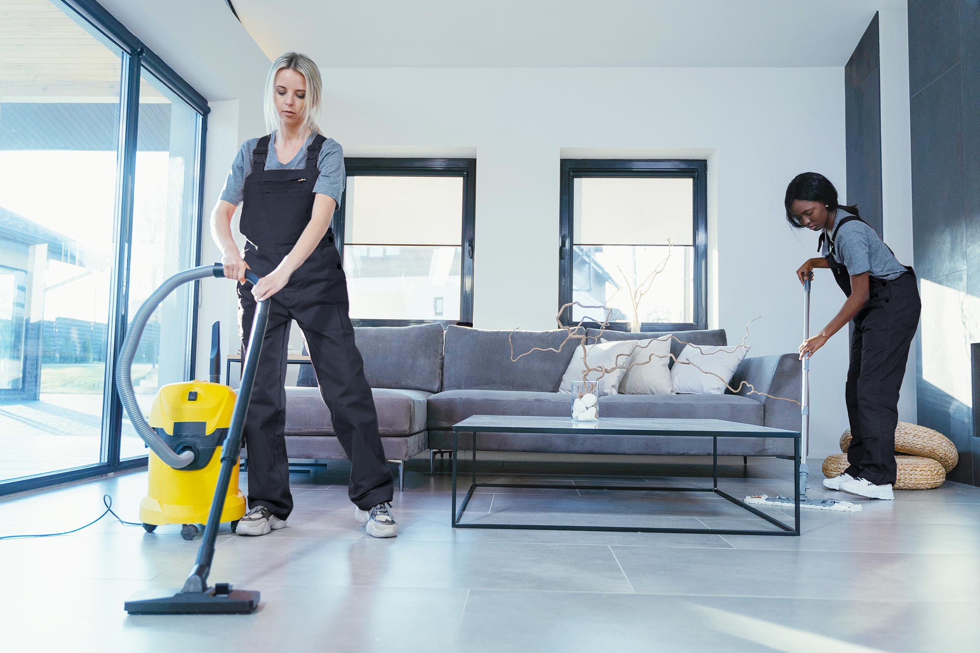 Maids vacuuming and sweeping