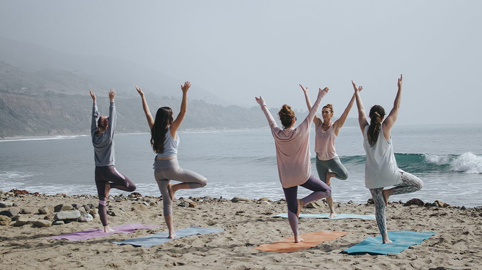 Yoga Class on the Beach insured with yoga teacher insurance.