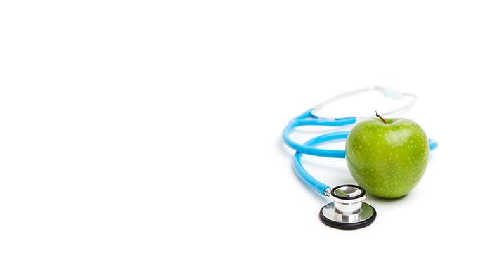 An apple and a stethoscope.