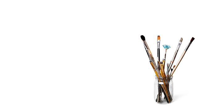 Picture of paintbrushes in a jar.