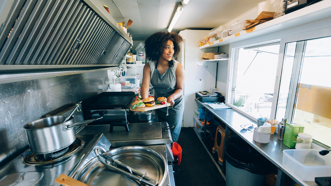 A food truck owner makes delicious meals.